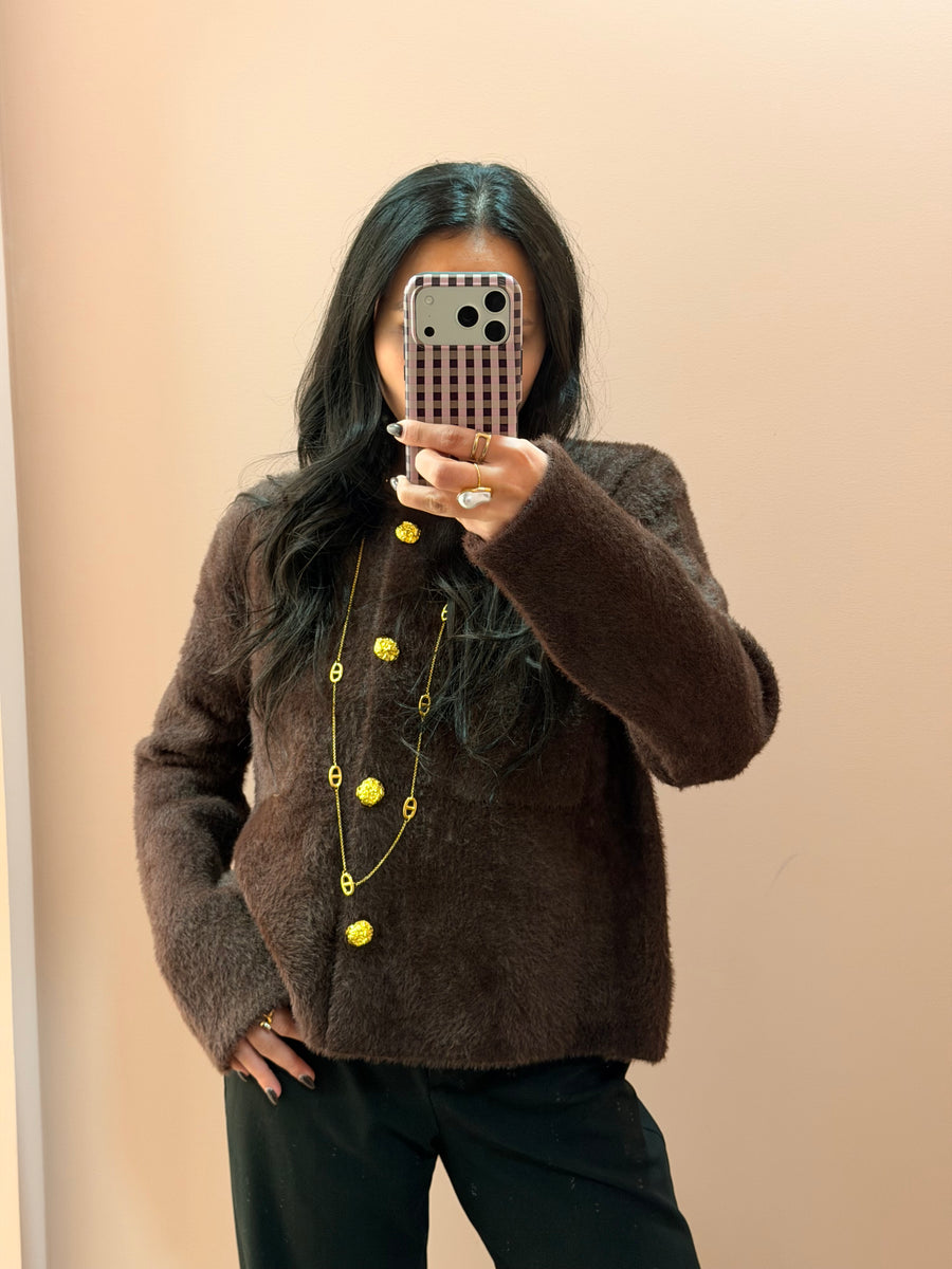 Veste avec boutons dorés